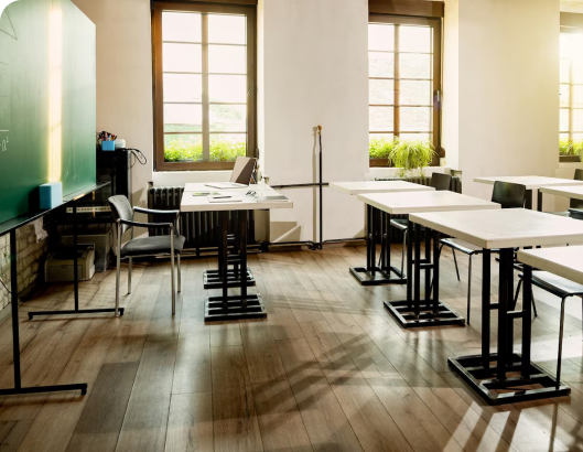 A classroom featuring tables and chairs, illustrating a space for learning and the impact of depreciation on furniture value.