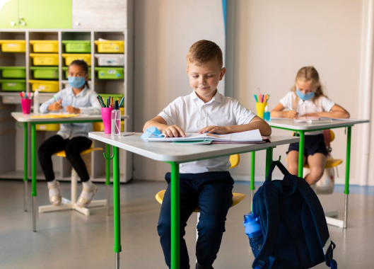 Children seated at desks in a classroom, evoking feelings of nostalgia and the comfort of familiar school days.